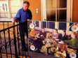 Ilja Kabakov in front of his flat in Graz, with a part of his installation Before Supper, 1988.   Courtesy: Grazer Kunstverein / Gert Heide  